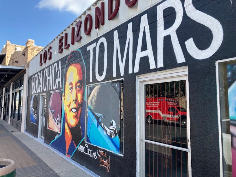 A mural of Elon Musk's in Brownsville, Texas face reflects the public support he has in many Texas communities.