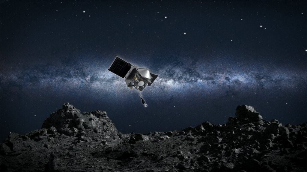 An artist's impression of OSIRIS-REx digging into Bennu.