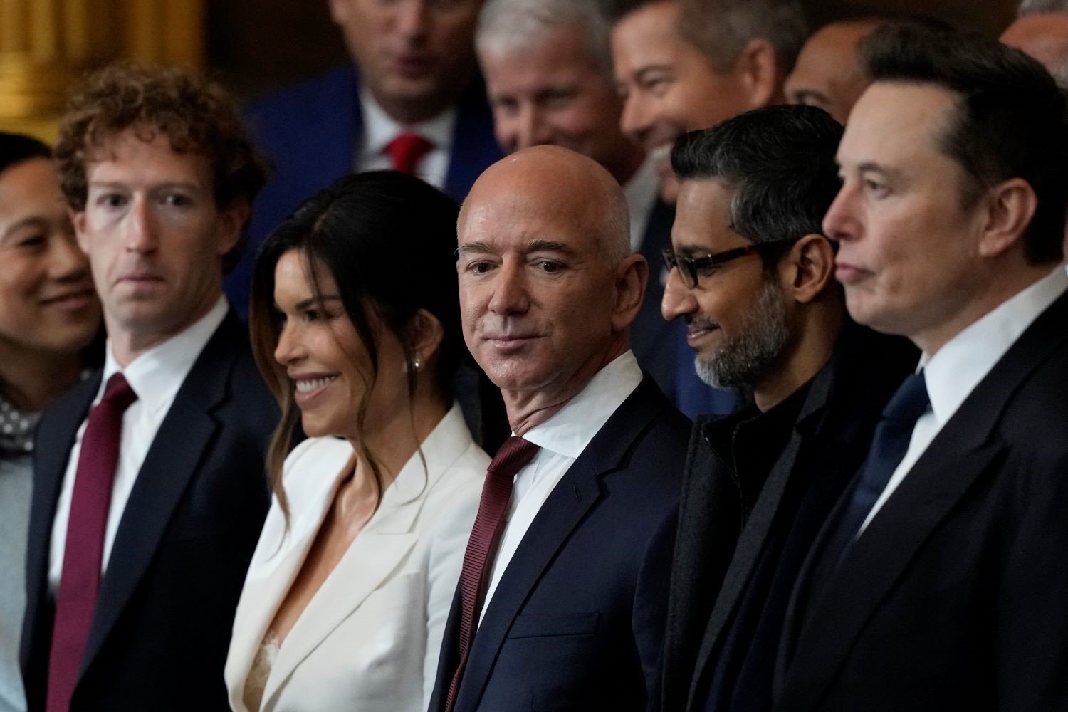 trump-freespeech-eo Mark Zuckerberg, Lauren Sanchez, Jeff Bezos, Sundar Pichai and Elon Musk stand in a line during the Inauguration of Donald J. Trump in the U.S. Capitol Rotunda.