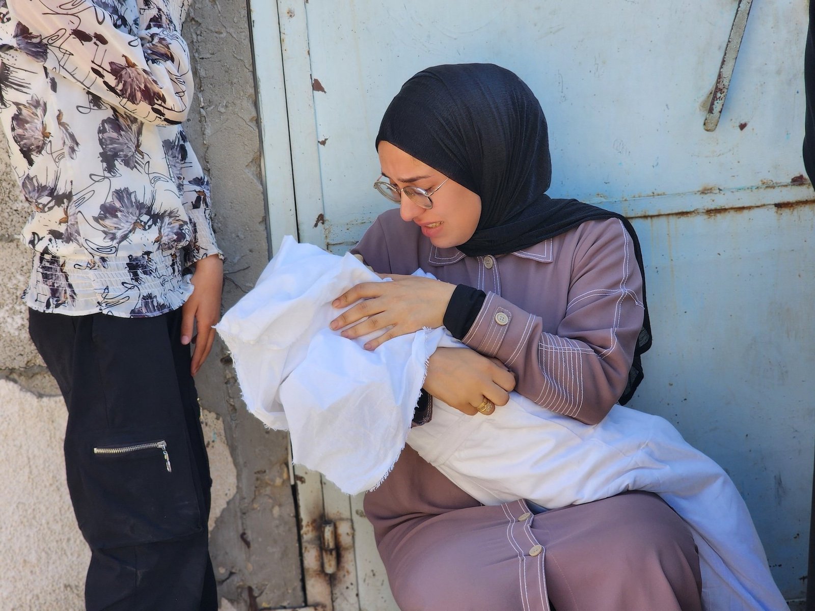 gaza-june-26-2025-getty A woman holds the body of a child at the morgue of the Nasser Hospital in Khan Yunis, Gaza on June 26, 2025, after Israeli attacks hit a residential area.